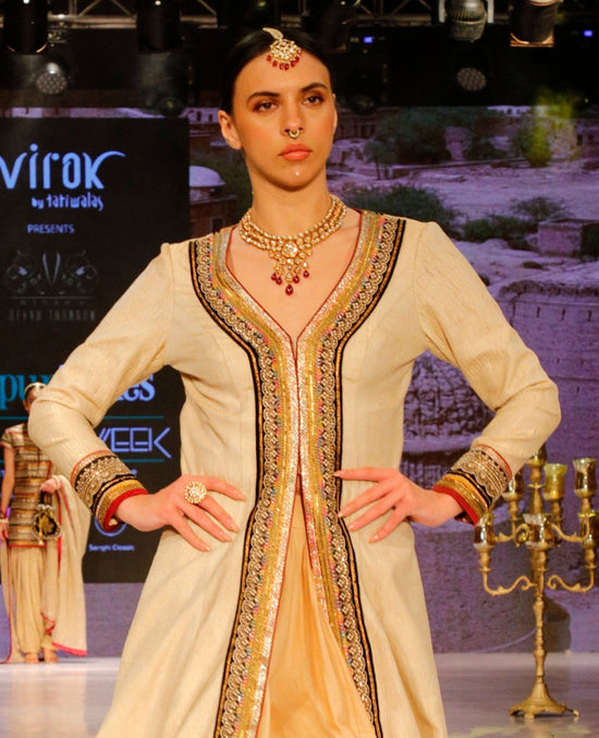 Off White Anarkali with a Gold Skirt.