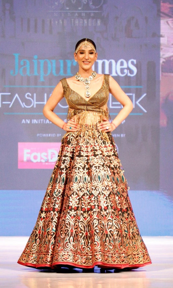 Black and Gold Lehenga with a Cut Out Fringe Blouse.