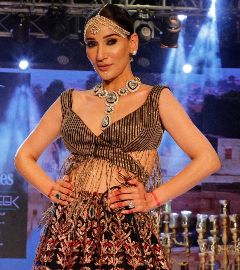 Black and Gold Lehenga with a Cut Out Fringe Blouse.